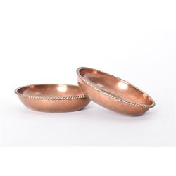 Pair of Arts & Crafts copper dishes by Gordon Russell, with lightly hammered finish and oblique gadrooned rim, impressed beneath 'Golf Hotel Grange Over Sands' and with maker's mark for Lygon