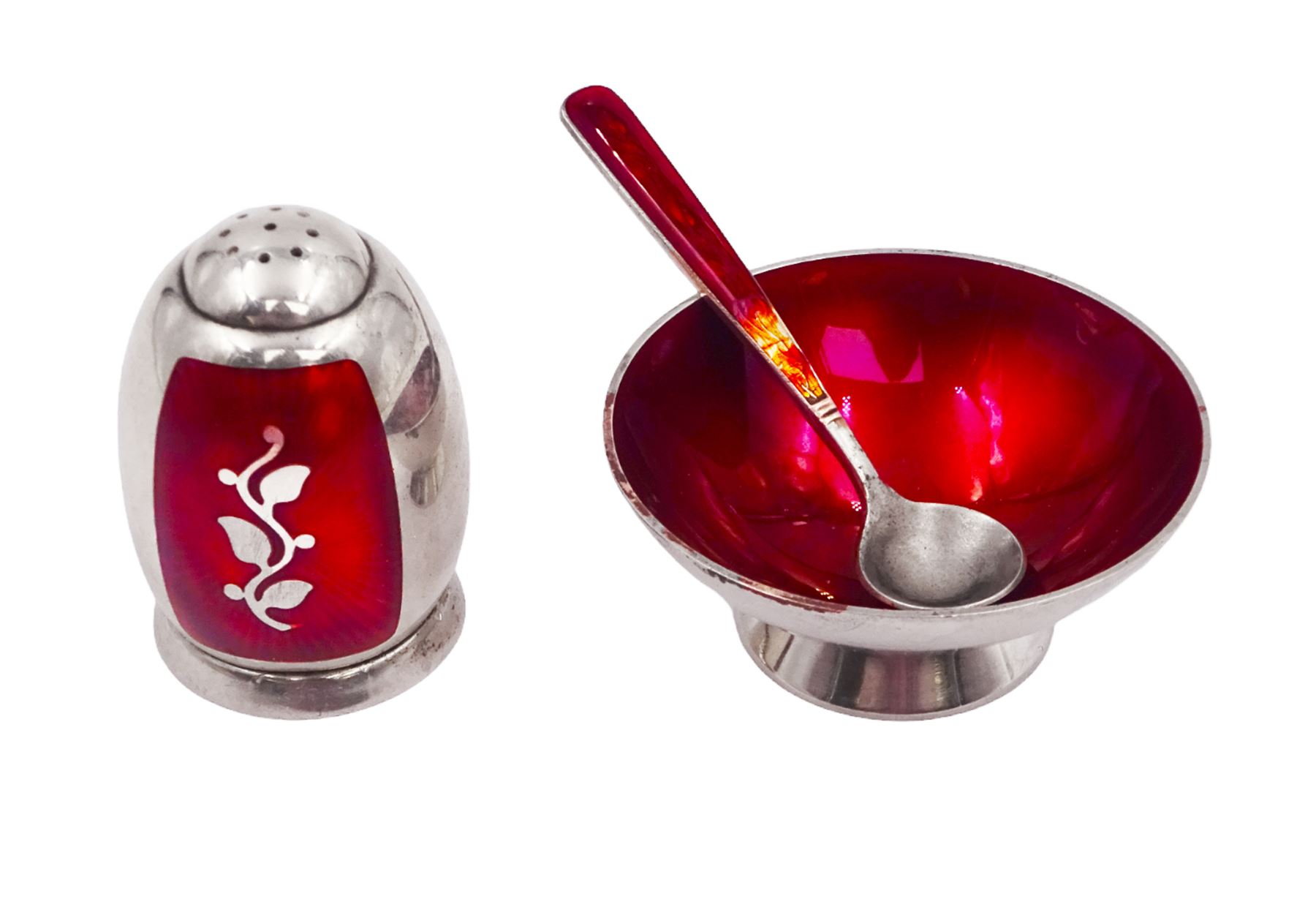 Mid 20th century Danish silver and guilloche enamel cruet set by Volmer Bahner, comprising pepper shaker, open salt and salt spoon, the spoon handle and bowl interior with red basse taille enamel and vine motif, the pepperette with panels of red guilloche enamel with similar applied vine decoration, all stamped Sterling Denmark VB, pepperette H4cm