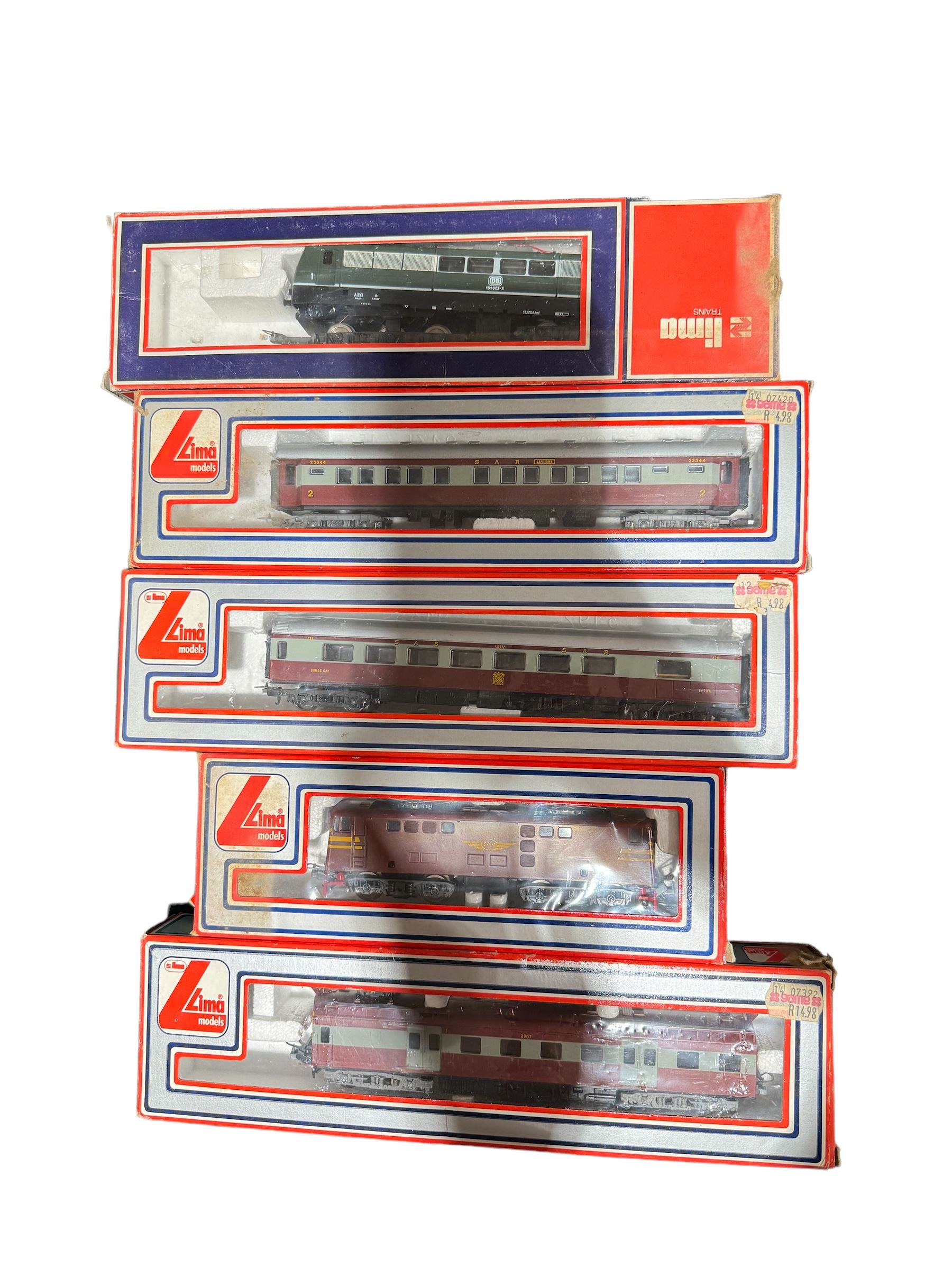 Lima HO gauge South African Outline rolling stock, comprising 209651 dummy locomotive no. E919, 208129 suburban train no. 8907, and two passenger coaches nos. 309243 and 309244, all in brown livery, together with a Lima 8054L electric locomotive no. DB 151002-3, all boxed (5)