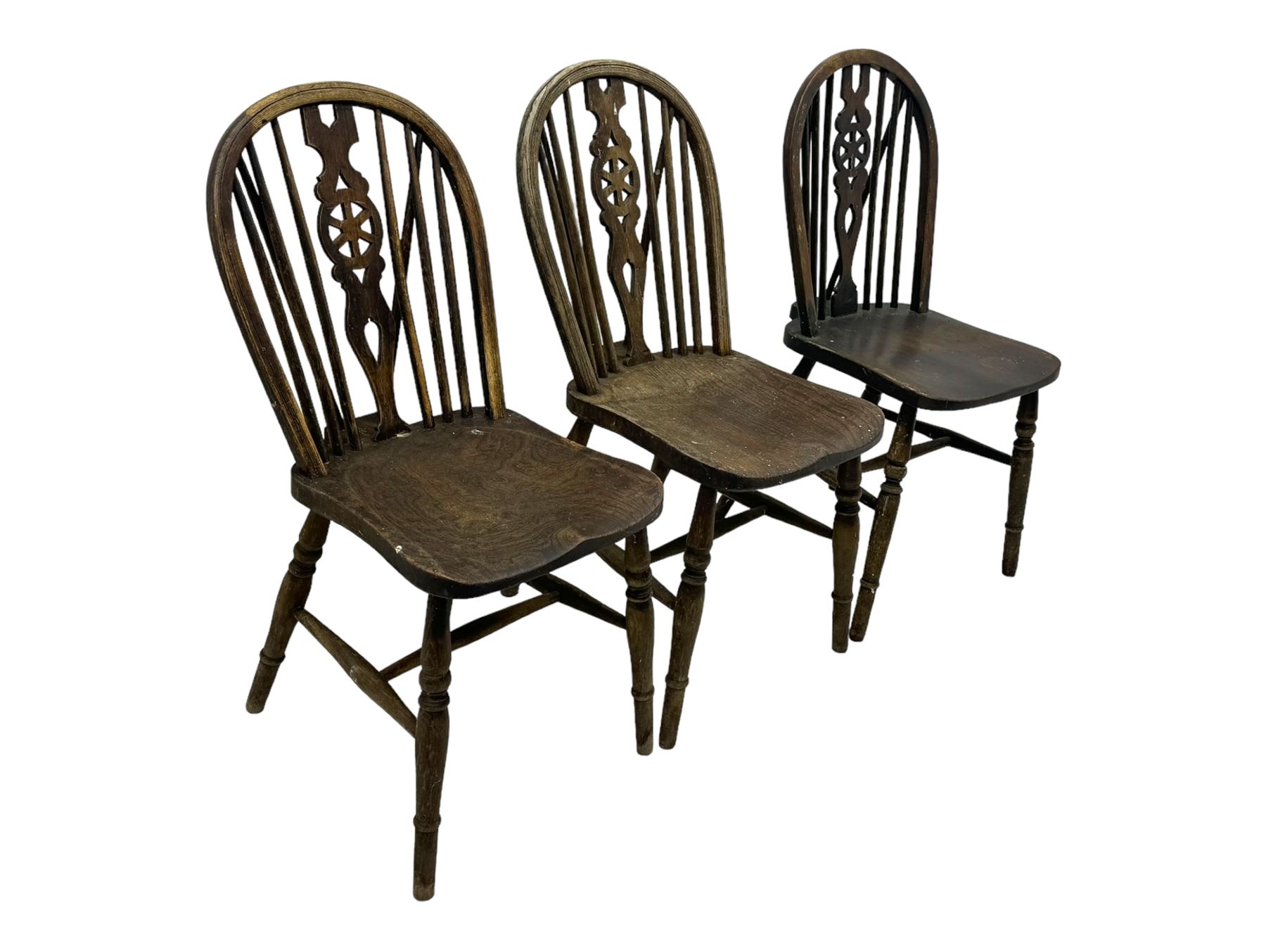 Mid-to-late 20th century set of six elm and beech Windsor dining chairs, hoop and stick back with pierced wheel splat, dished elm seat, on turned supports united by turned stretchers 