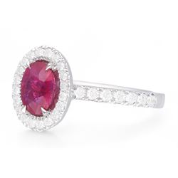 18ct white gold oval cut ruby and round brilliant cut diamond cluster ring, with diamond set shoulders, hallmarked, ruby approx 0.80 carat, total diamond weight 0.37 carat 