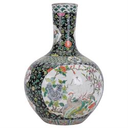 19th century Chinese famille noire bottle vase, decorated with two large reserves painted with ho ho birds amidst blossoming peonies, and six smaller reserves of flowers, against a black ground profusely decorated with leafy tendrils, with character mark beneath, H36cm