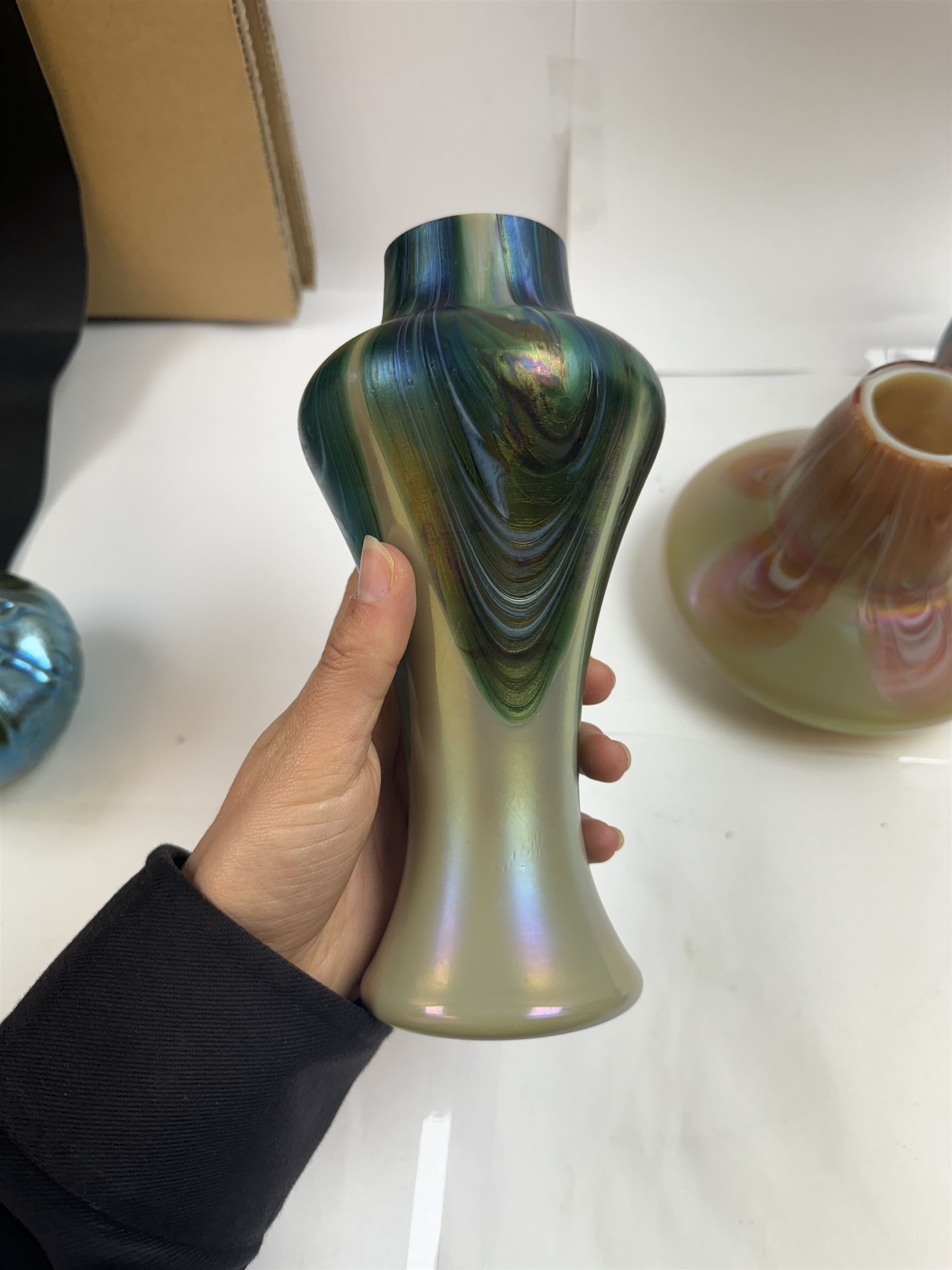 Three Austrian Art Nouveau iridescent glass vases by Rindskopf, all of varying form, each with pulled feather decoration to body, tallest H20.5cm