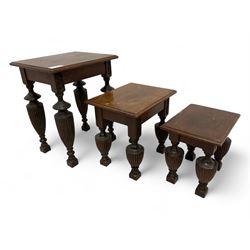 Late Victorian walnut nest of three tables, rectangular top with moulded edge, raised on reeded and turned urn shaped supports with acanthus leaf carving and square feet