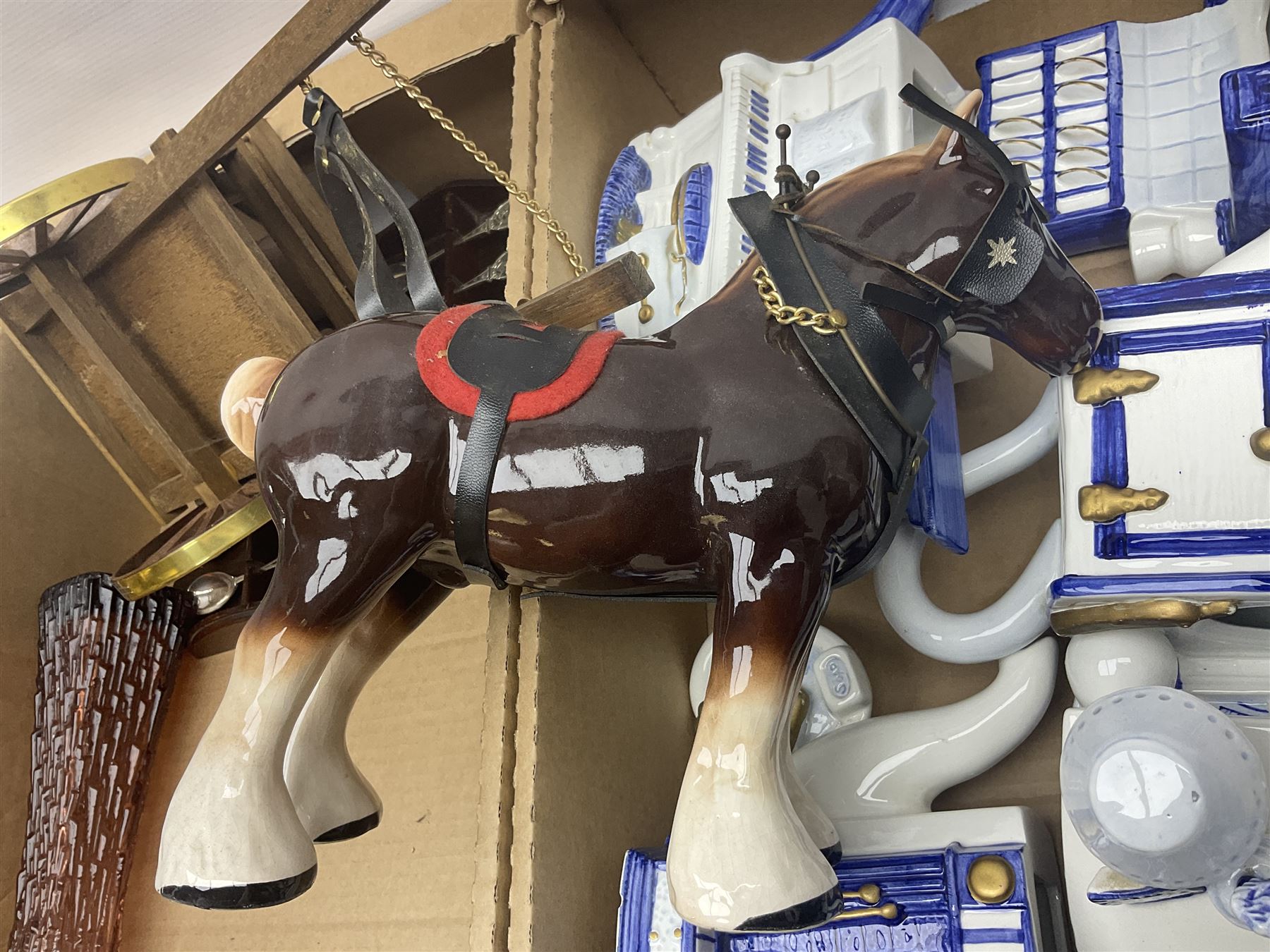 Commemorative ware, including mugs, shots glasses, plates and book etc, together with a ceramic shire horse and wooden cart, four Leonardo blue and white tea pots, and a collection of other ceramics and glassware, in three boxes 