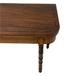 Early 19th century mahogany tea table, rectangular fold-over top with rounded corners, inlaid with mahogany banding, the plain frieze with mahogany stringing, raised on gate-leg action ring turned supports