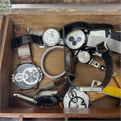 Gold plated Egyptian style ring, two silver wedding bands, and collection of watches including Fitbit and Swatch, housed in a writing slope