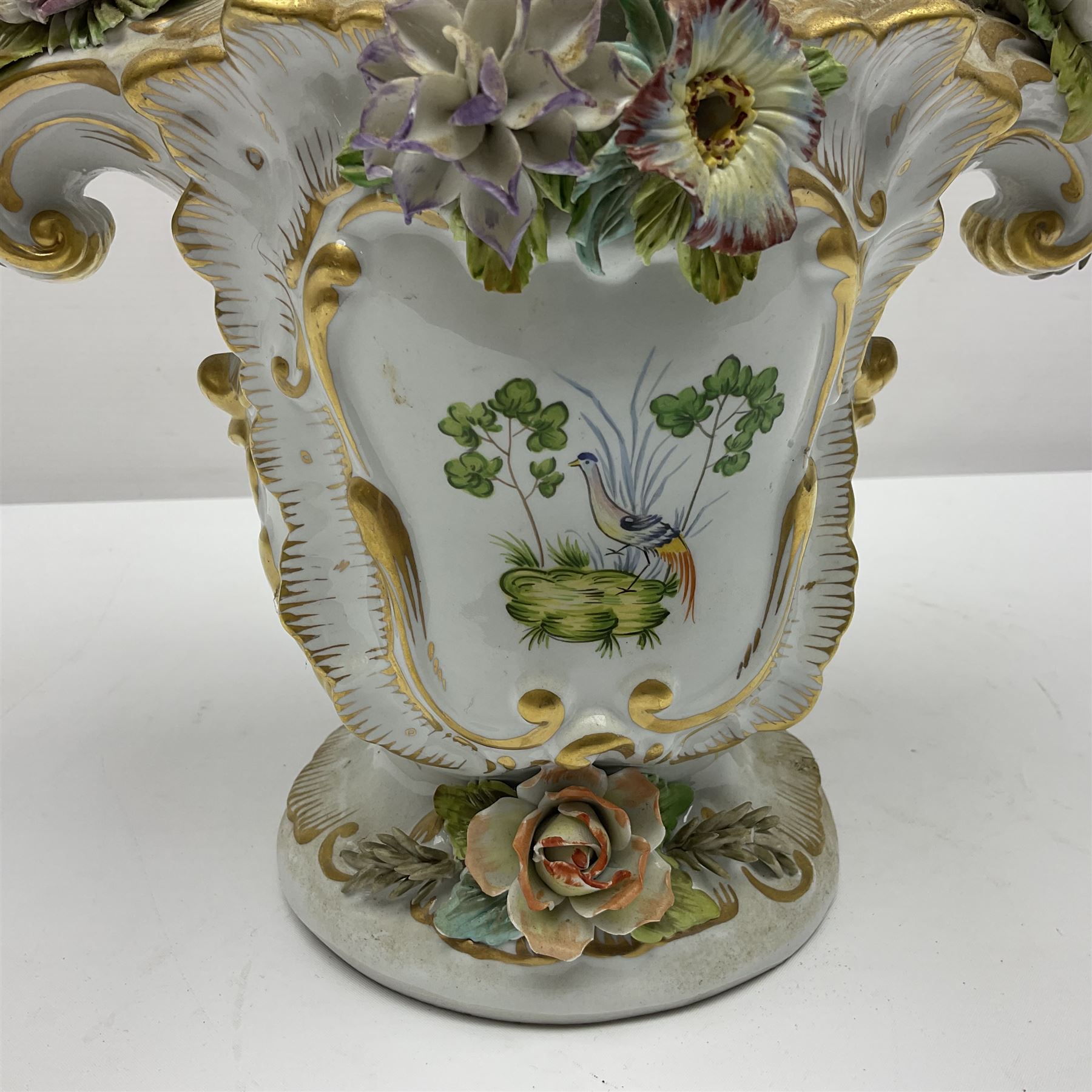 Continental vase and cover, with painted panels of birds in foliage, with applied flower decoration to the body and cover, H38cm 