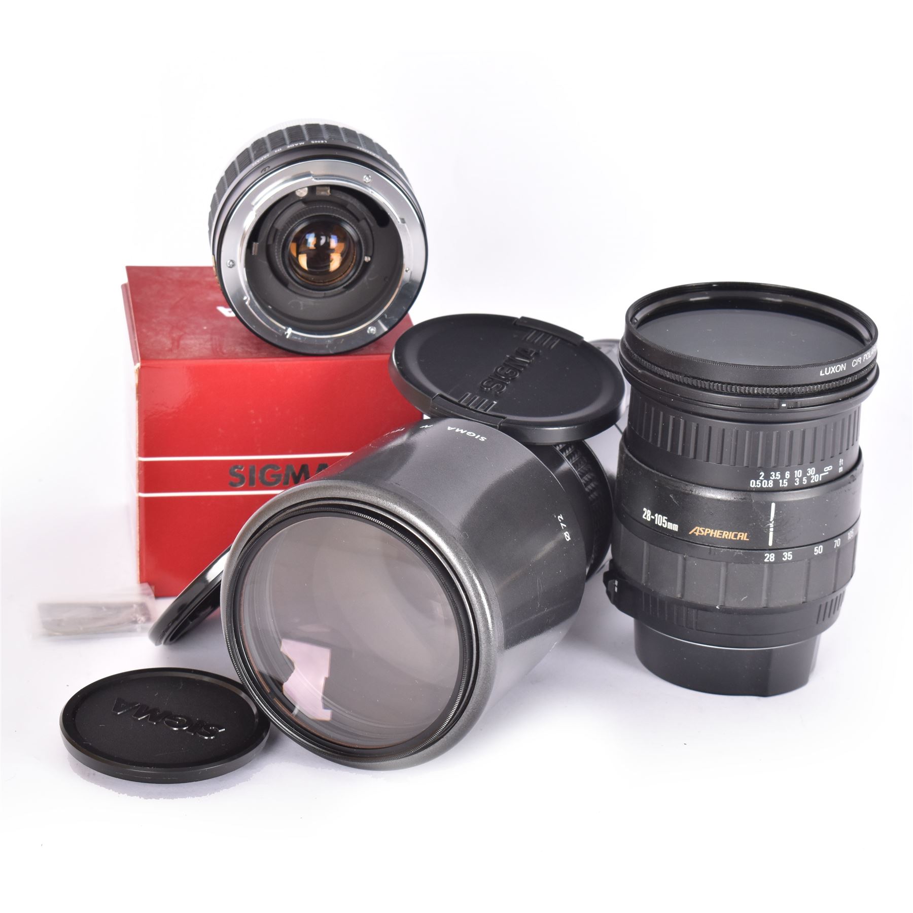 Two Sigma camera lenses, comprising 28-105mm 1:2.8-4 aspherical zoom lens serial no. 1005268, with Luxon CIR polarizer 72mm filter, hood and lens caps, an AF Tele 1:56 f=400mm multi-coated lens, serial no. 3021847, and a Sigma Tele-Macro multi-coated 2x teleconverter, boxed