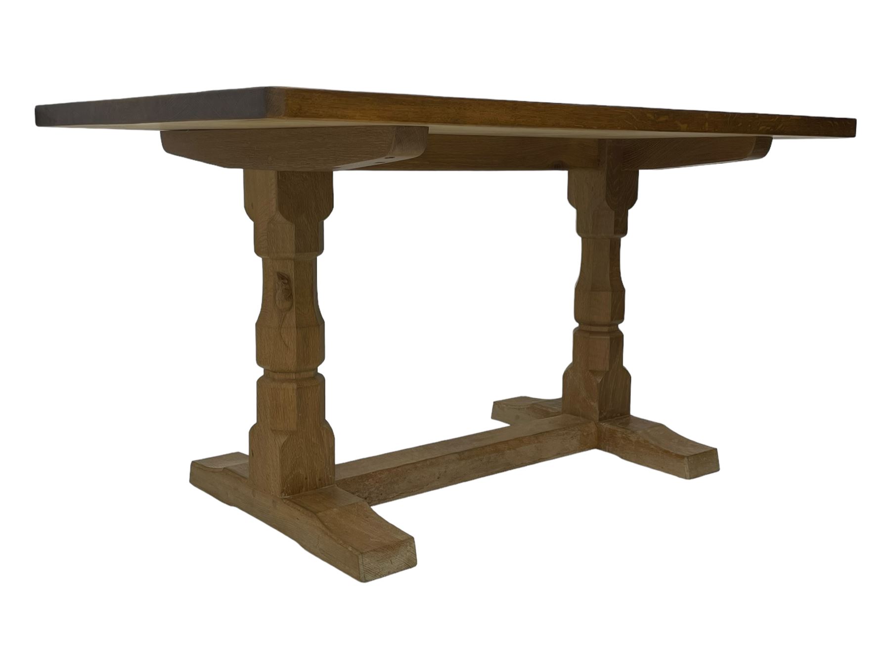 Mouseman - oak dining table, rectangular adzed top with rounded corners, octagonal pillar supports on sledge feet united by floor stretcher, carved with mouse signature, by the workshop of Robert Thompson, Kilburn