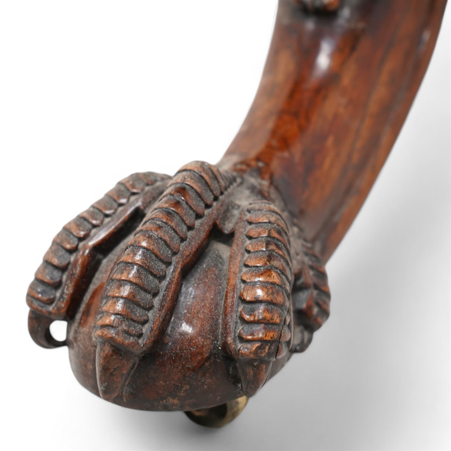 19th century rosewood tripod table, circular tilt-top with gadroon carved edge, turned column with lobed bands and curled acanthus leaf carved baluster, three out-splayed supports with shell carved knees and scaled ball and claw feet, 

Provenance:
Nidd Hall: acquired by Guy Reed from
Richard Butler, 17th Viscount
Mountgarret, in 1968