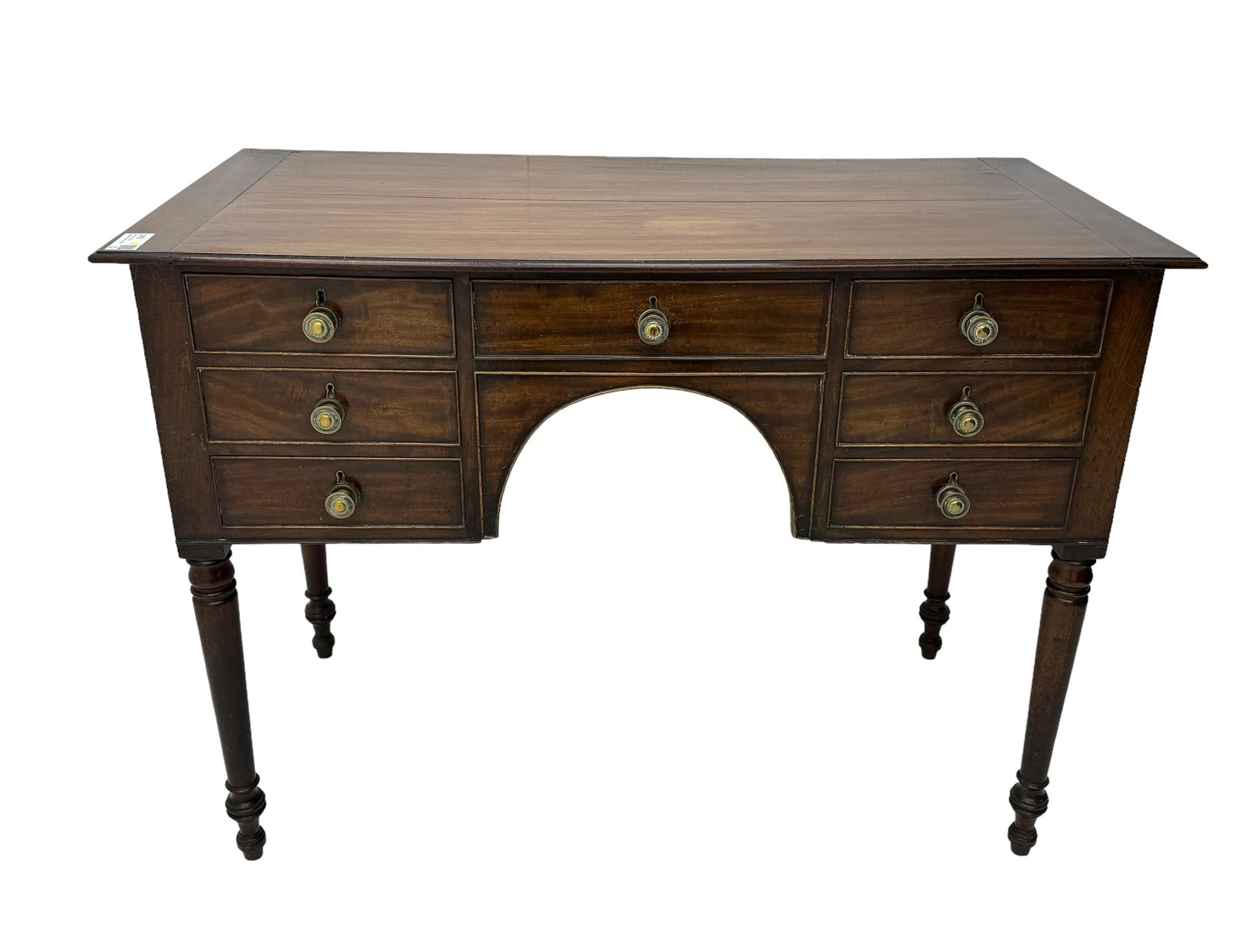 George III mahogany kneehole dressing or side table, moulded rectangular top over seven cock-beaded drawers, on ring turned support 