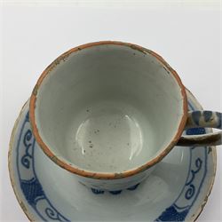 Rare 18th century English delft coffee cup and saucer, circa 1760, probably Liverpool, the cup painted with rockwork, flowers and bird, the saucer painted with central stylised flower head and lattice and scroll border, cup H6cm, saucer D10.5cm