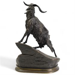 After Jules Moigniez, bronze figure of a goat climbing a rock, on oval plinth, inscribed signature, H28cm