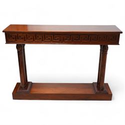 Neoclassical design mahogany console table, rectangular top over Greek key carved frieze with foliate carved back and sides, raised on twin pilaster end supports with acanthus capitals, on a plinth base