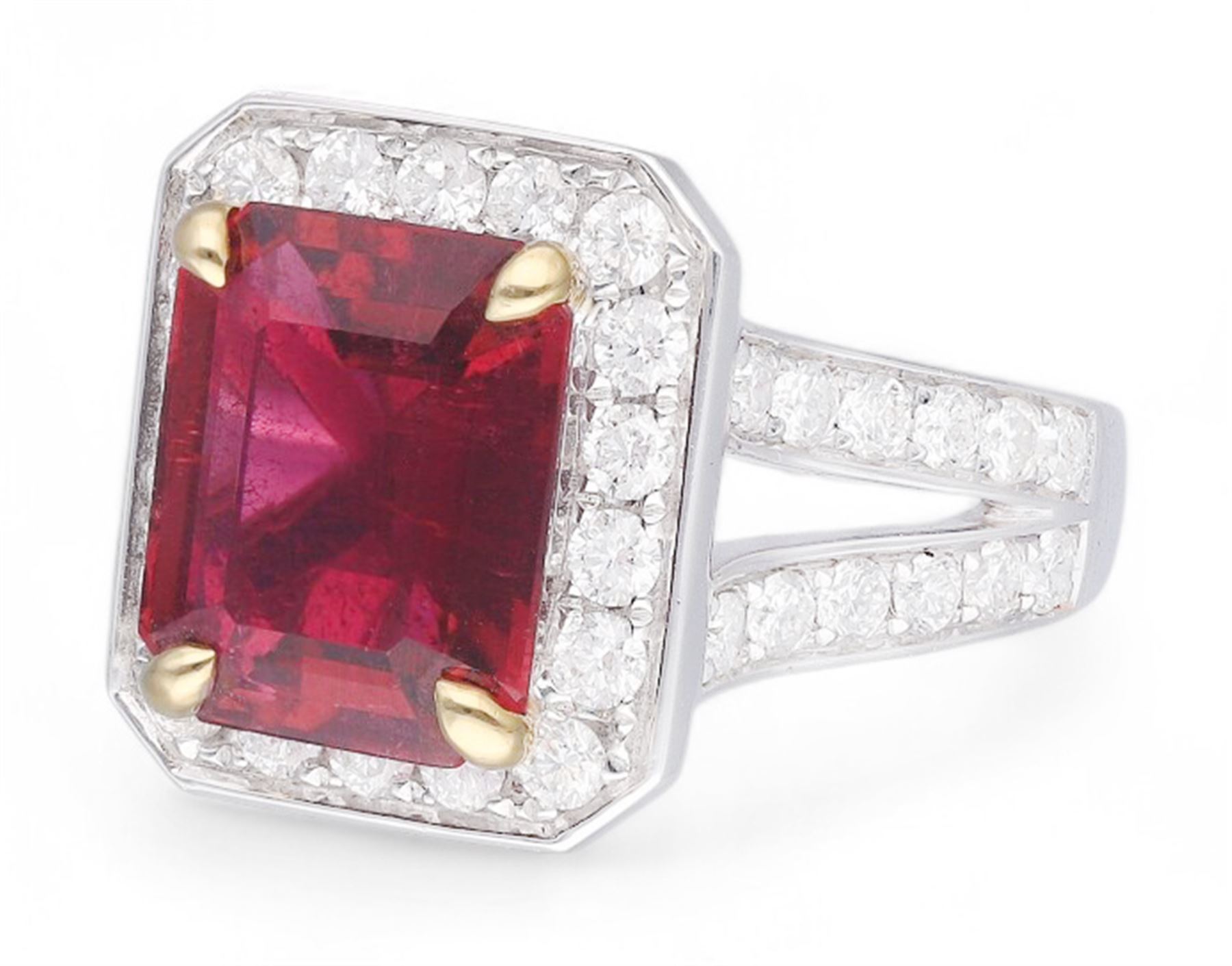 18ct white gold emerald cut rubellite tourmaline and round brilliant cut diamond cluster ring, with diamond set shoulders, hallmarked, rubellite 4.05 carat, total diamond weight 1.24 carat 