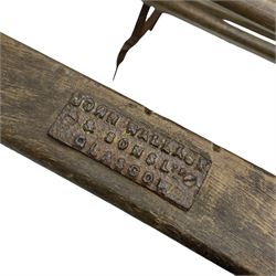 Victorian wrought metal strapwork and wooden ice sledge or chair, wooden slats on shaped strapwork frame and rail, makers plaque inscribed 'John Wallace & Sons Glasgow' 