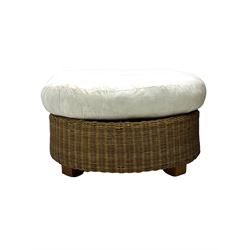 Rattan armchair and ottoman set, pair of armchairs featuring rounded backrests with wide armrests, woven wicker frame with weaving and upholstered seat cushions in off-white fabric with flowing floral pattern (W83 D80 H78cm); matching round ottoman with upholstered cushion on square wooden feet (W65 D65 H37cm)