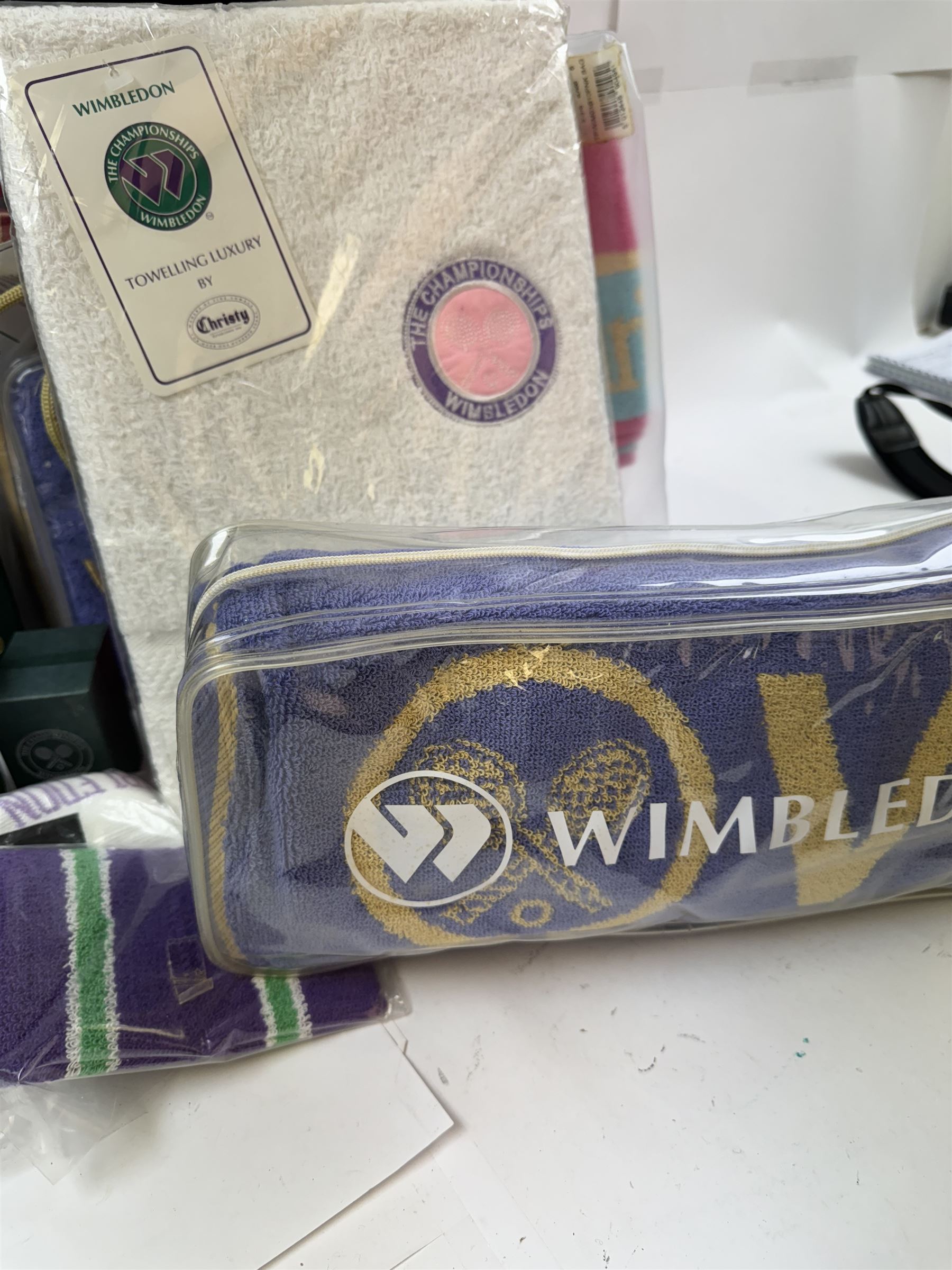 Collection of Wimbledon tennis memorabilia, including towels, programs, mugs, t-shirt, keyrings, ephemera etc