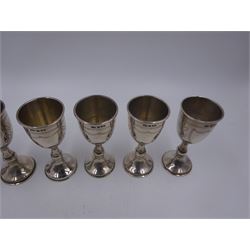 Set of six 1920s silver Kiddush cups, of goblet form with knopped stem, and engraved foliate detail, hallmarked London 1929, maker's mark M.S, H9cm