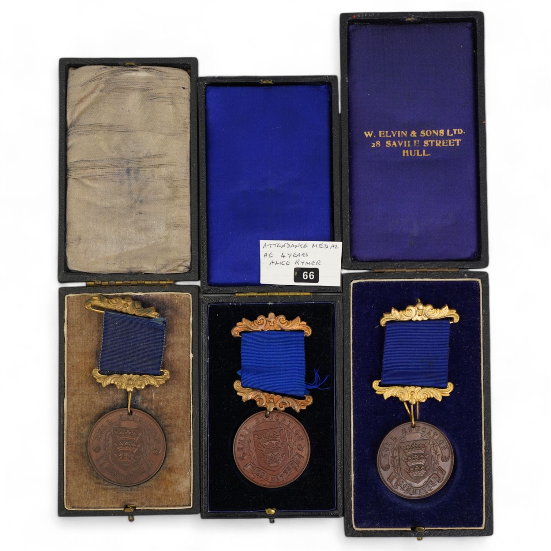 Eighteen Hull Education Committee 'Perfect Attendance At School' medallions, six cased and three Hull Times Long Service Medals 'For 25 Years Continuous Service', housed in a Lindner tray