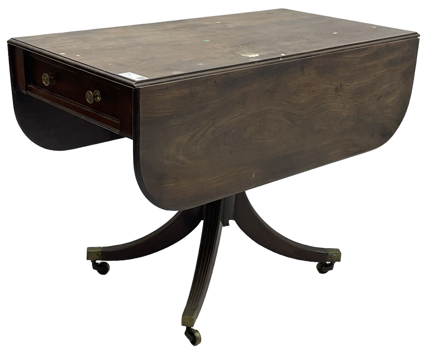 George III mahogany Pembroke table, moulded rectangular drop-leaf top with rounded corners, fitted with single cock-beaded end drawer, on turned pedestal with four reed moulded supports, brass cups and castors 