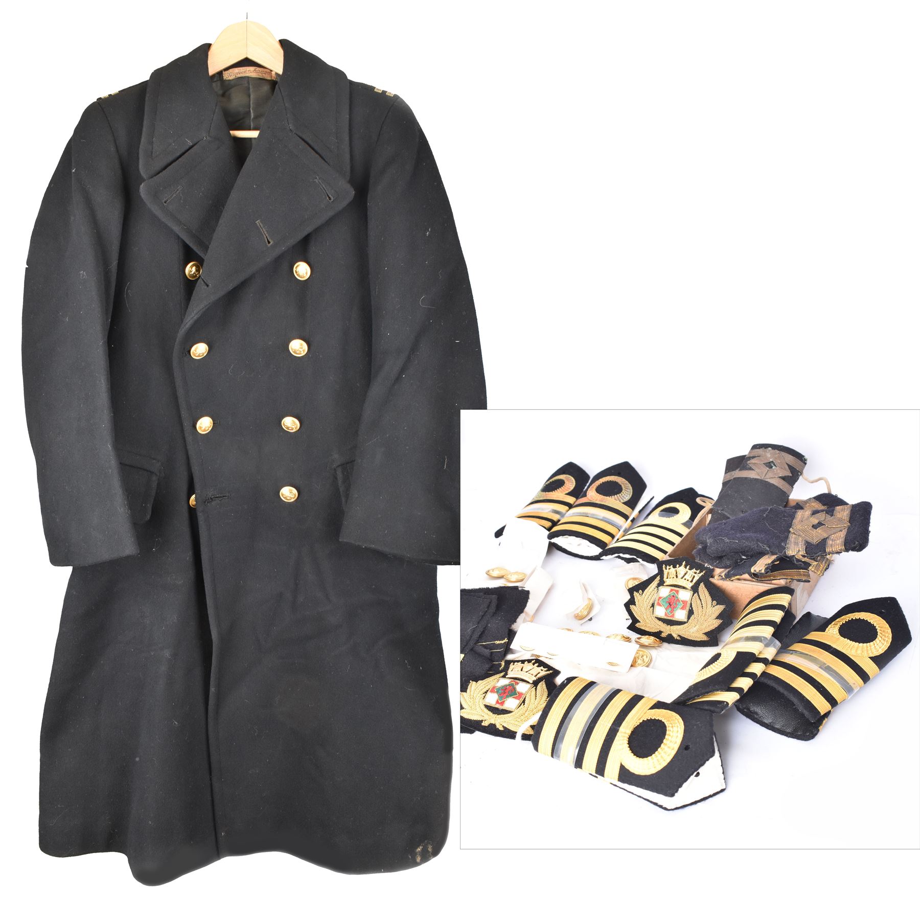 Royal Navy Lieutenant's Frock Coat by Haycock and Jarman, together with other naval accessories, including four pairs of Captain's insignia, six pairs of Captain's shoulder boards, a Merchant Navy cap badge and a collection of other badges, buttons and shoulder boards 