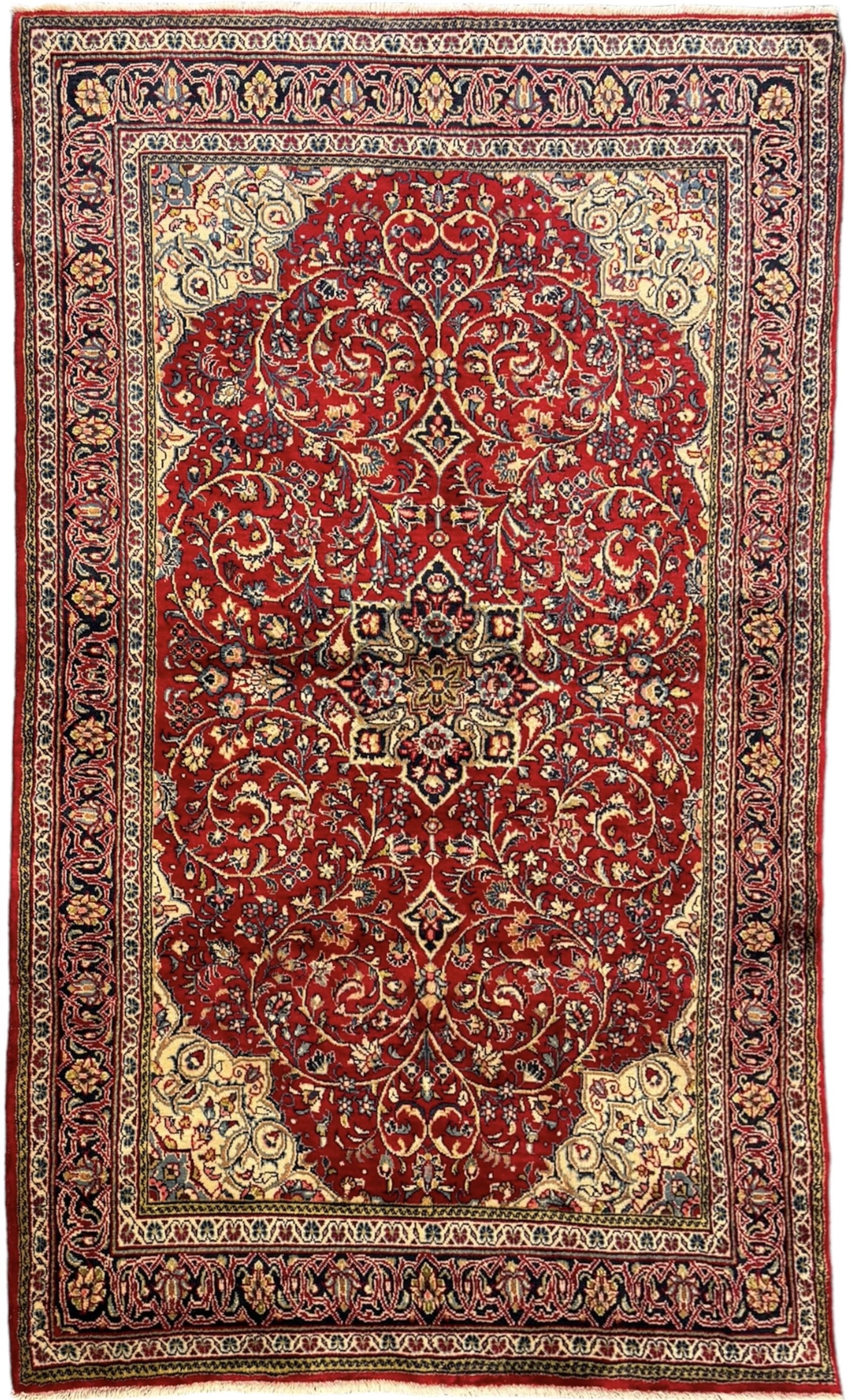 North west Persian Sarouk crimson ground rug, central floral medallion surrounded by scrolling branches decorated with foliage and stylised plant motifs, the main border decorated with repeating scrolling design with floral motifs, within guard stripes 