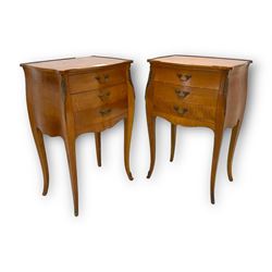 Pair of late 20th century French design cherry wood bedside lamp tables, shaped bombe form, fitted with three drawers, on tapering cabriole supports, decorated with ornate cast gilt metal mounts 