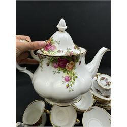 Royal Albert Old Country Roses tea service for six, comprising teapot, milk jug, open sucrier, cups and saucers, dessert plates, two trinket dishes covered jar and clock