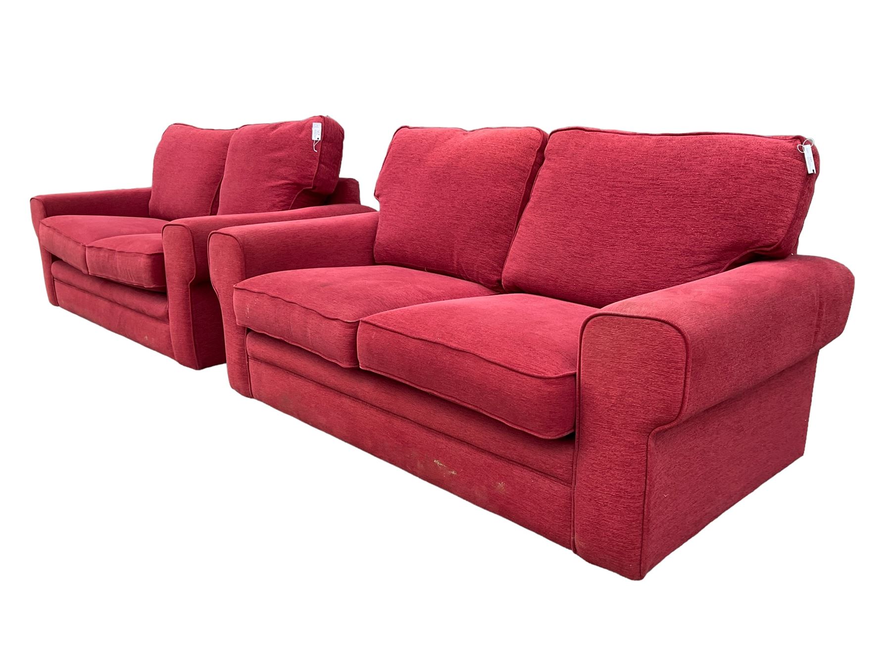 Pair of two seat sofas, upholstered in red fabric