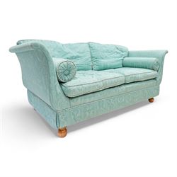 Regency shaped hardwood-framed two-seat sofa, upholstered in turquoise fabric decorated with arches enclosing birds of paradise and seahorses, on turned bun feet 