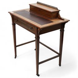 Edwardian inlaid mahogany writing desk, raised correspondence compartment over leather inset top, fitted with single drawer, on square tapering supports with brass and ceramic castors 