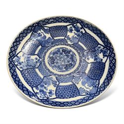 Japanese blue and white charger, decorated with a central floral pattern the border with p...