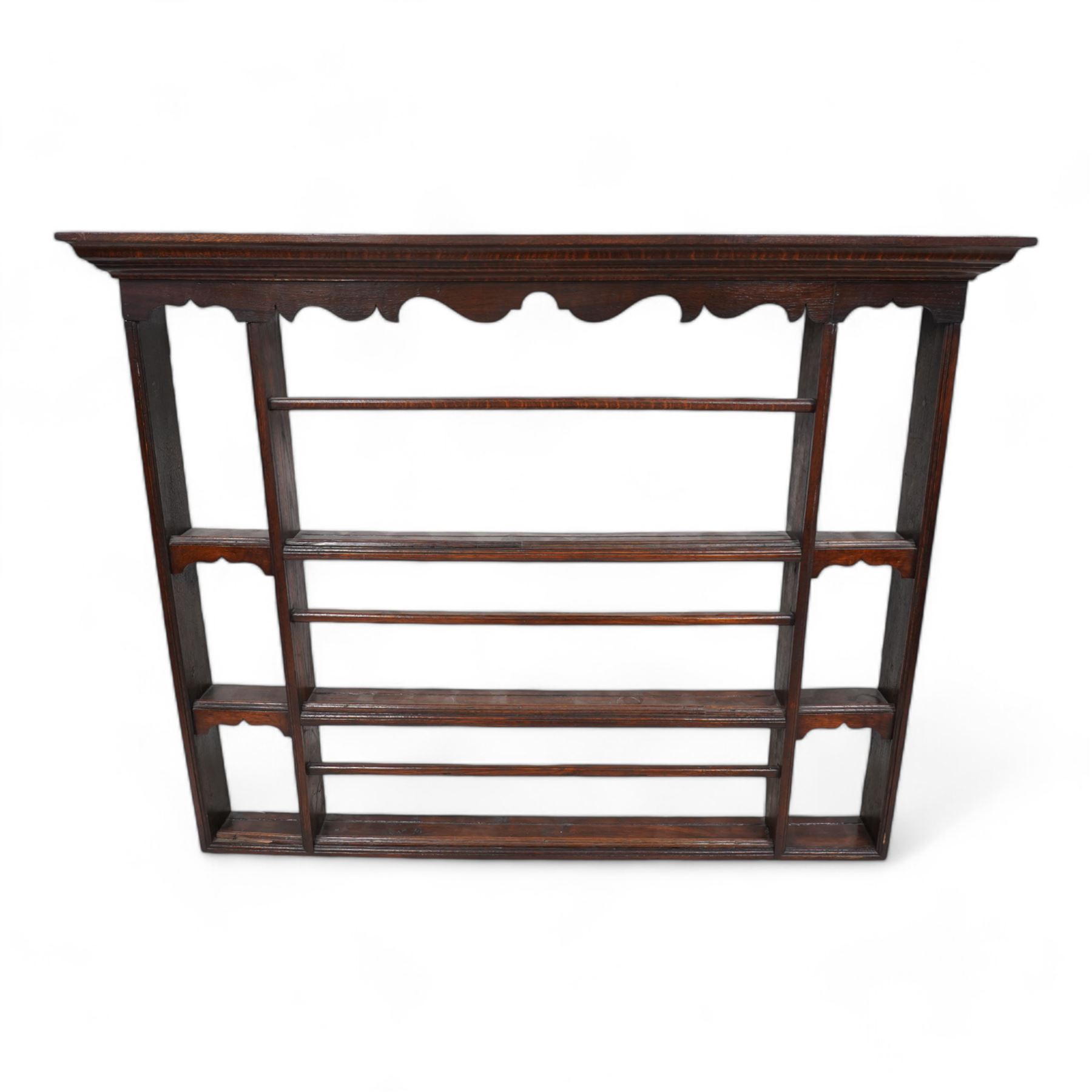 19th century oak wall hanging delft rack, projecting moulded cornice over shaped frieze, fitted with three shelves 