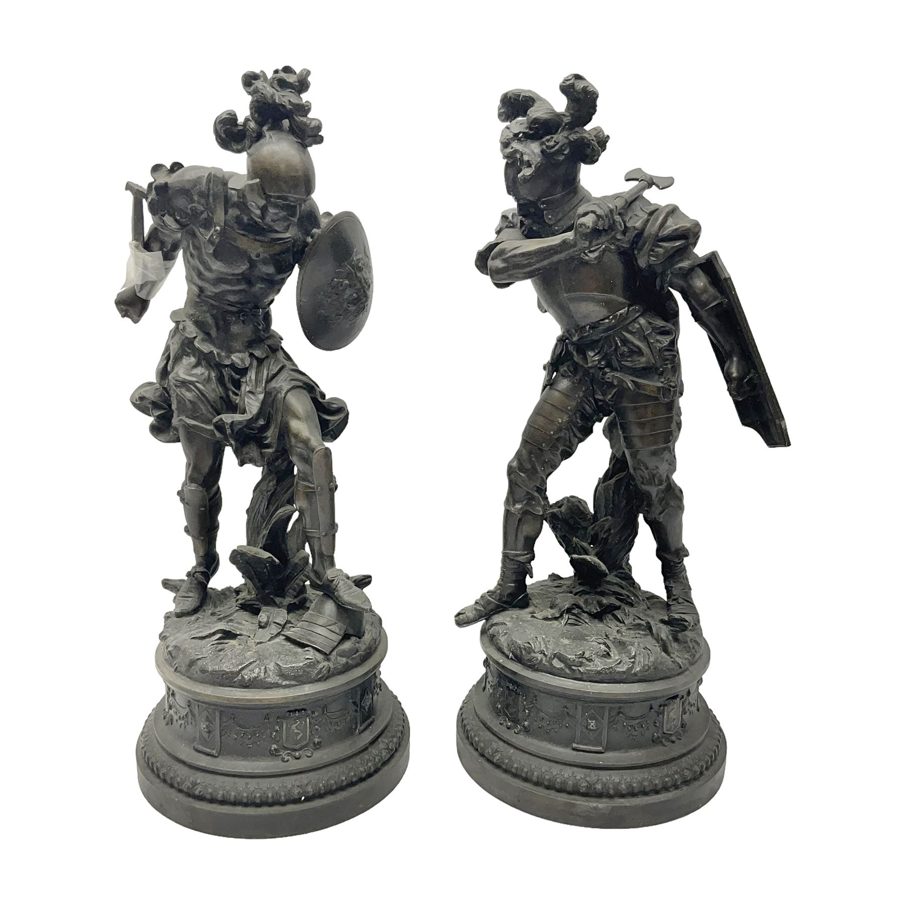 Pair spelter warriors, both with shields with a naturalistic ground and a plinth with relief decoration, H51cm