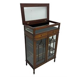 Edwardian mahogany bijouterie display cabinet, featuring satinwood inlay and crossbanding, hinged glazed top fitted with two banded drawers, over two astragal glazed doors enclosing black wool baize lined shelves with gold trim, supported by spade feet