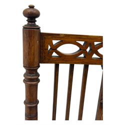 Edwardian inlaid rosewood elbow chair, pierced cresting rail over carved ribbon tie and oval inlaid panel, upholstered in stripe and floral pattern fabric, on square tapering supports with spade feet 