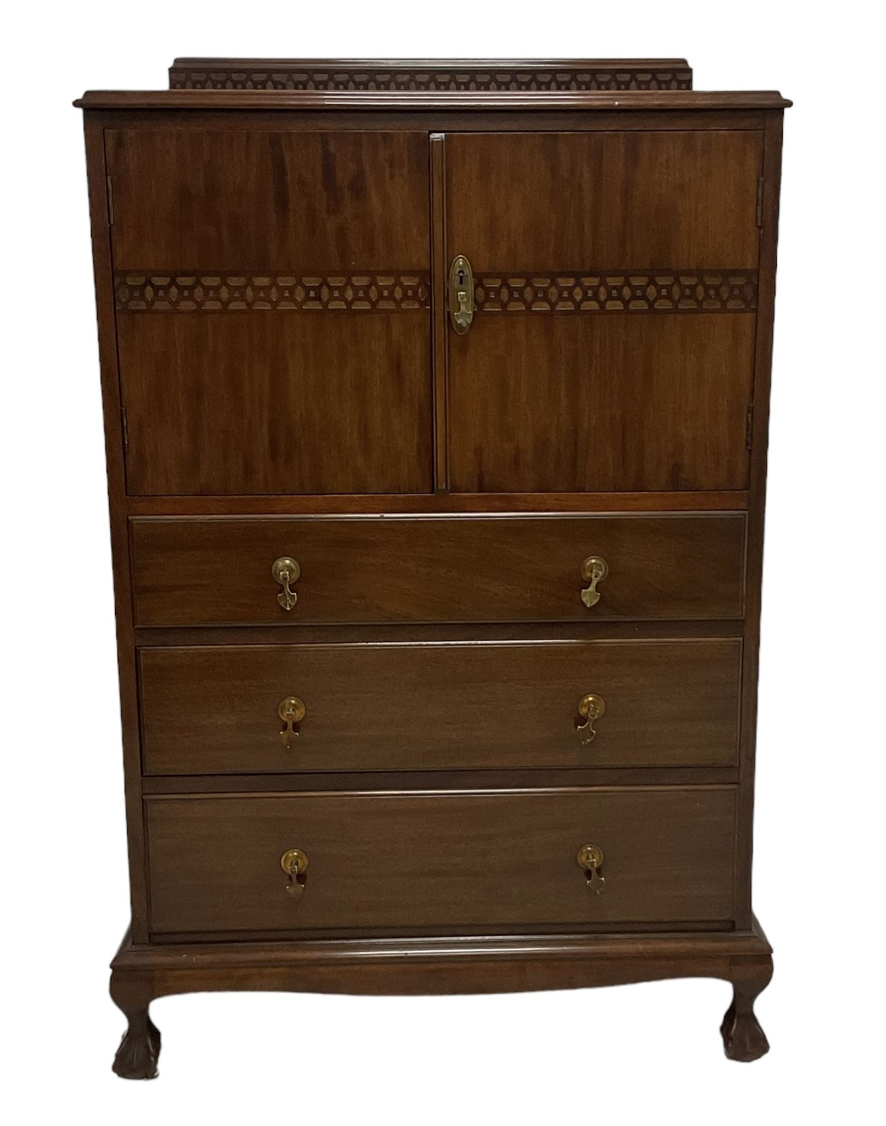 Early 20th century mahogany tallboy, double cupboard over three drawers, on ball and claw carved cabriole feet