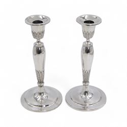 Pair of continental silver candlesticks, probably German Hanau, each of tapering form, wit...