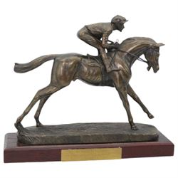 'Go Racing in Yorkshire Special Achievement Award, Guy Reed' - Bronze resin figure of a racehorse with jockey up on wooden plinth 30cm x 35cm and another 'Winning Owner Cadbury Cup July 2008 York Racecourse' on wooden base 30cm x 33cm (2)