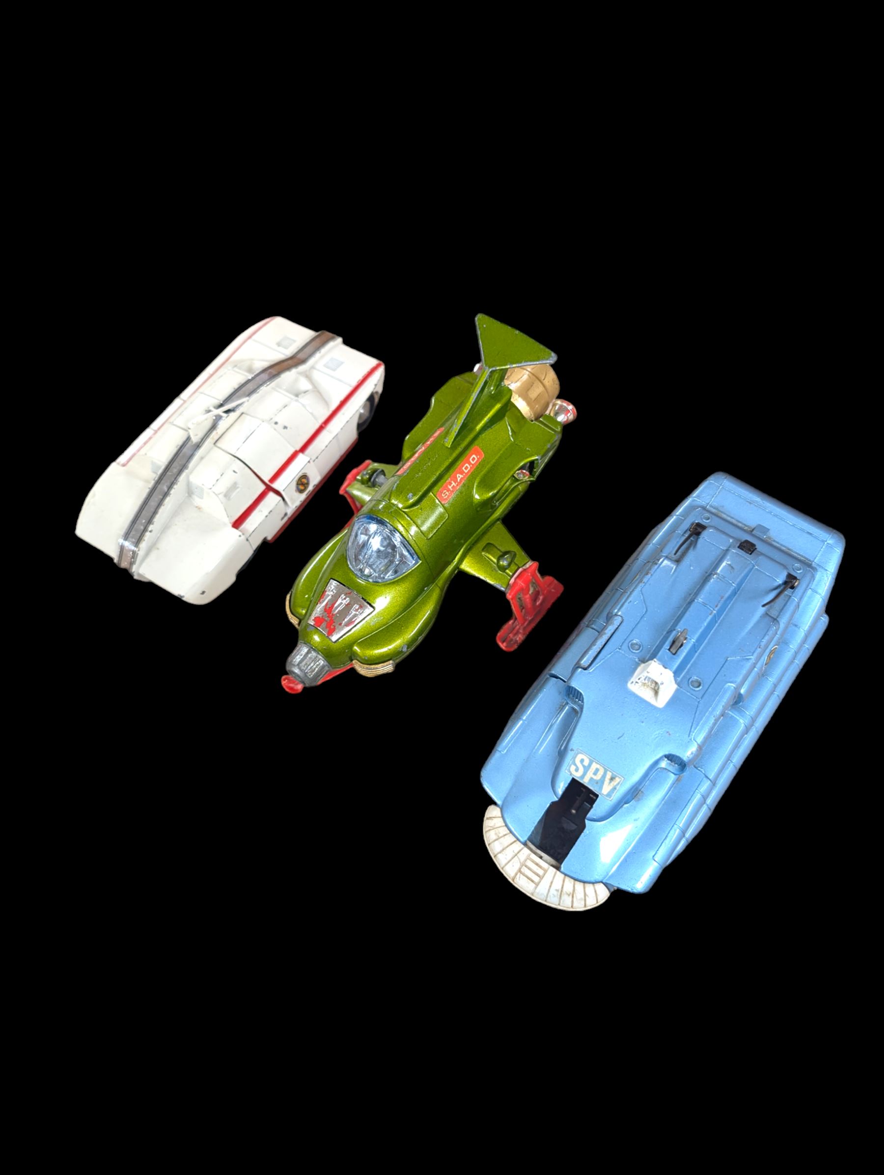 Three Dinky toys, comprising Spectrum Pursuit Vehicle, Maximum Security Vehicle, and UFO Interceptor, unboxed and playworn 