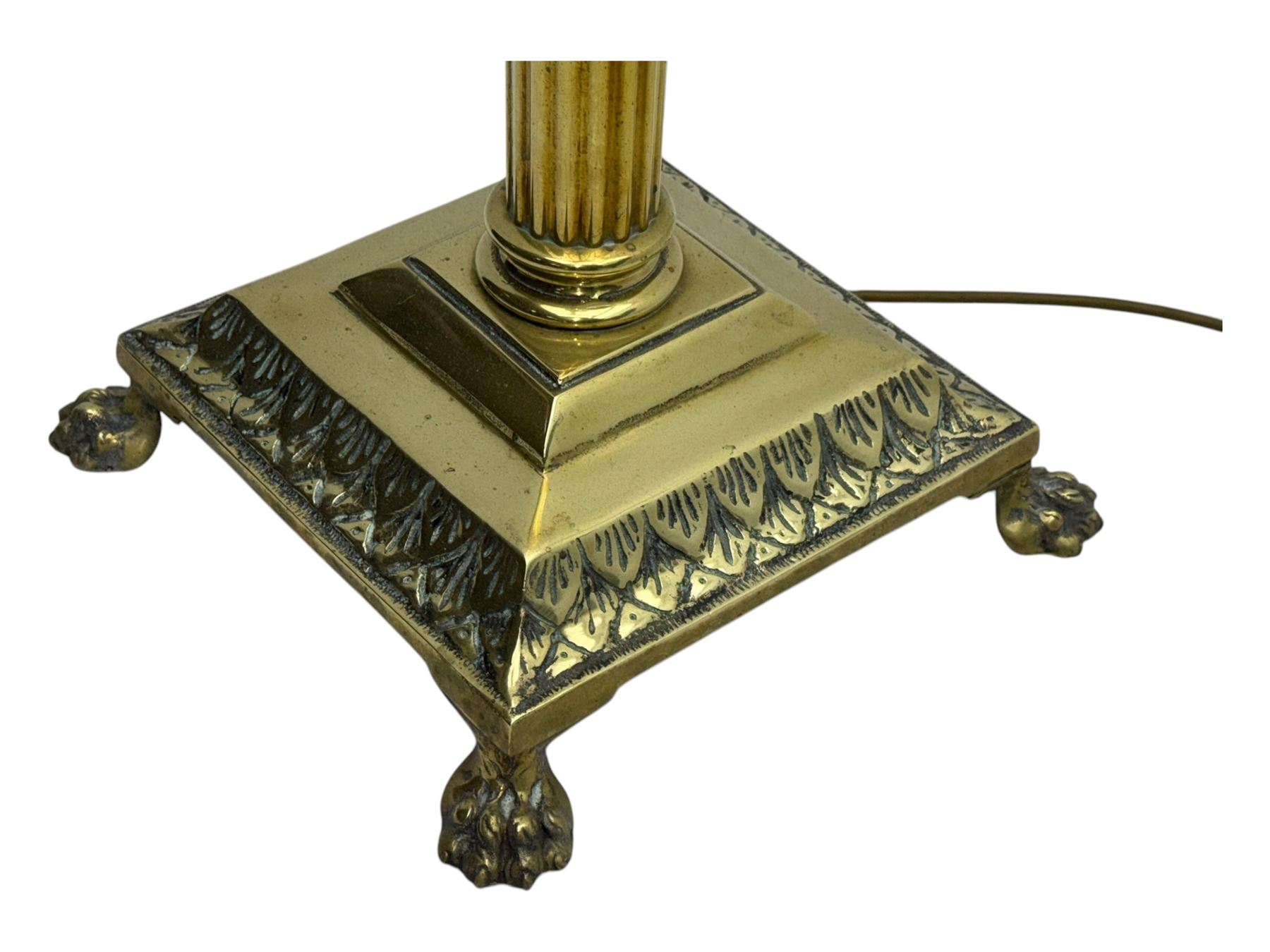 20th century brass standard lamp, Corinthian column stem on moulded square base with paw feet 