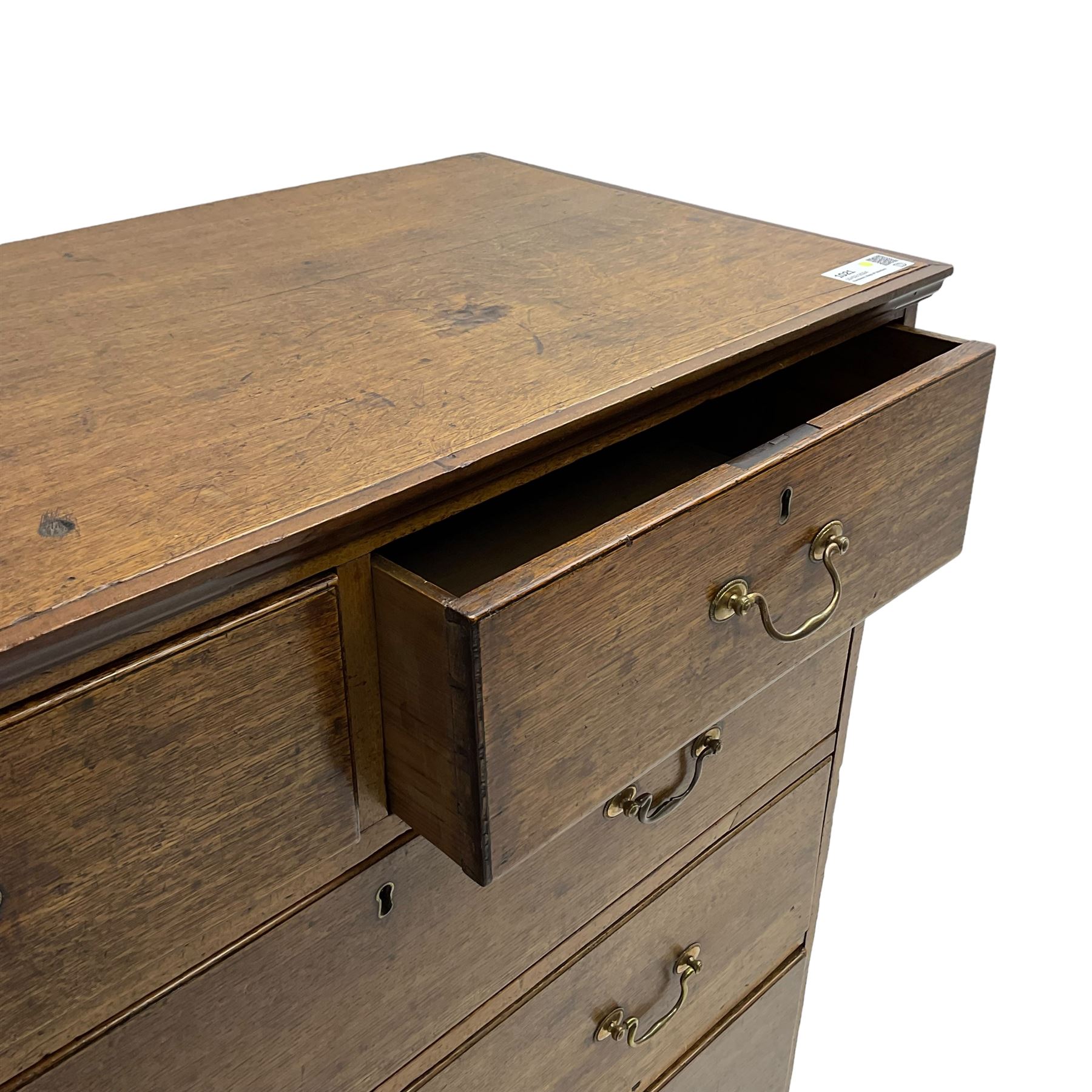 George III oak straight-front chest, fitted with two short over three long graduating drawers, lower moulded edge over shaped bracket feet