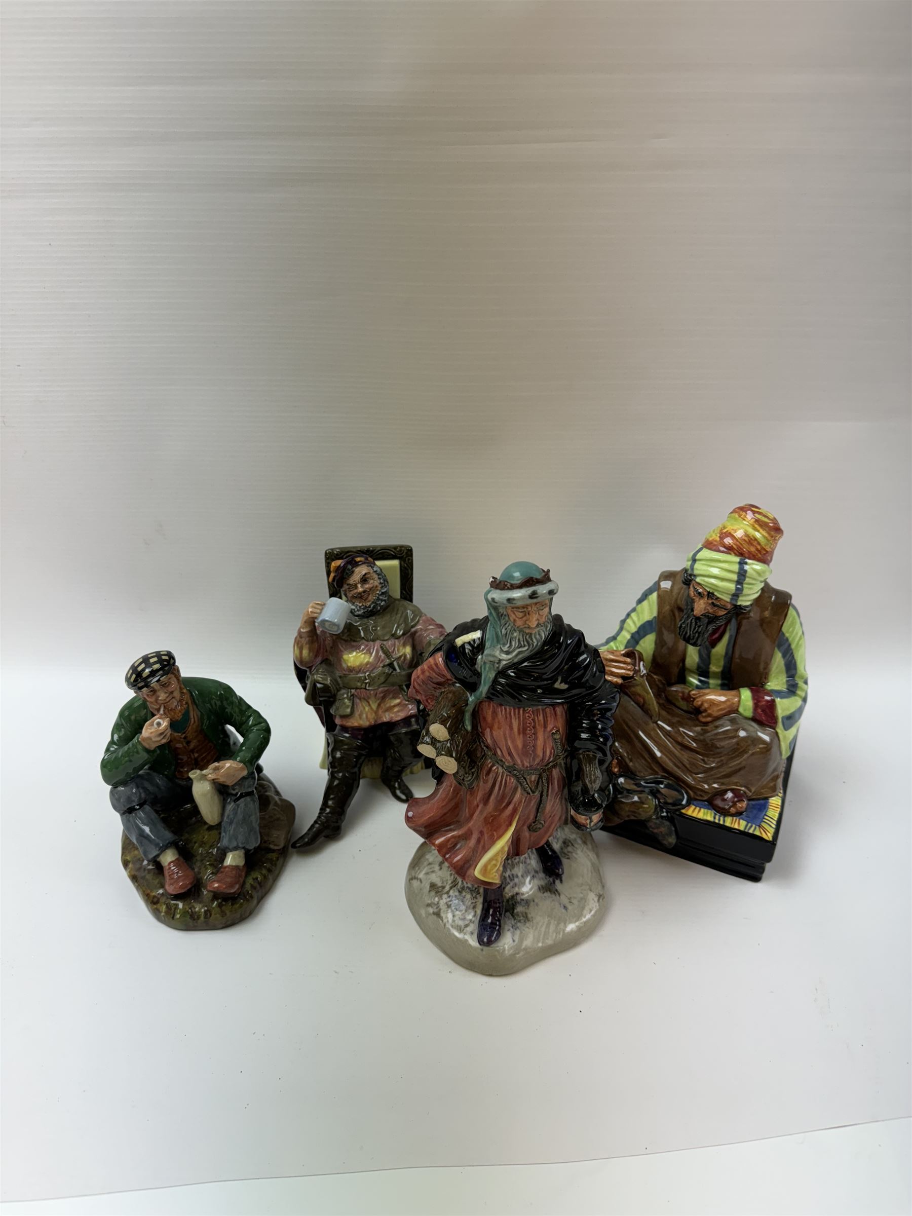 Four Royal Doulton figures, comprising Cobbler HN1706, Good King Wenceslas HN2118, The Foaming Quart HN2162, and The Wayfarer HN2362