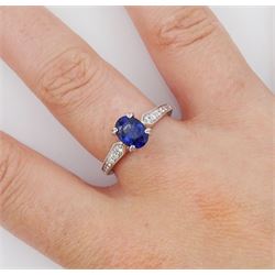 18ct white gold oval cut sapphire ring, with milgrain set round brilliant cut diamond shoulders, hallmarked, sapphire approx 0.80 carat, total diamond weight approx 0.40 carat