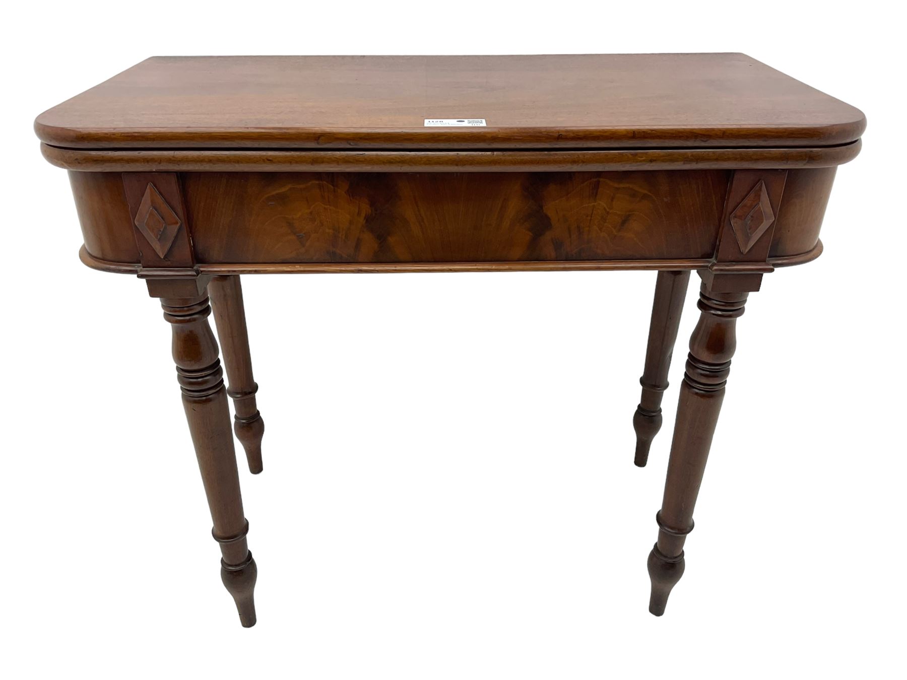 19th century mahogany tea table, fold-over swivel action rectangular top with rounded corners, figured frieze with stepped lozenge mounts, on turned supports