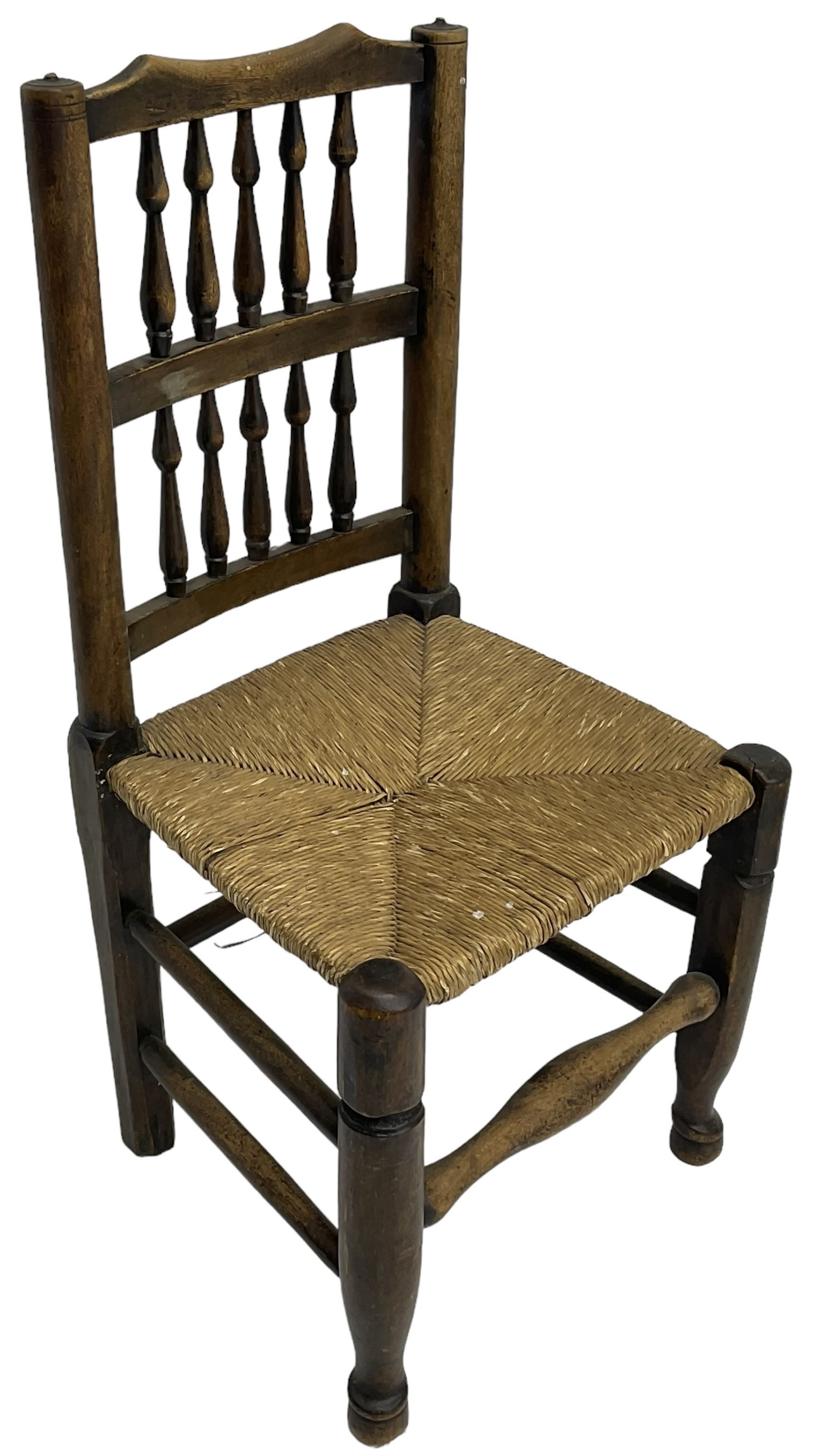 Collection of chairs - five 19th century elm spindle back chairs with rush seats; two chapel chairs (7)