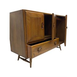 Lucian Ercolani for Ercol - 1960s elm sideboard, fitted with double cupboard, single cupboard and drawer, on tapering supports 