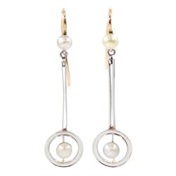 Pair of early 20th century 15ct gold and platinum pearl pendant earrings, pearls within hoop frames and suspended from knife edge bars to pearl surmounts 